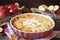 French cuisine. Red apple clafoutis, powdered sugar dressing