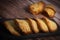 French delicacy pastry tuile with almond on wood background