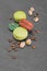 French dessert. Sweet chocolate and pistachio macaroons or macarons with coffee beans and nuts