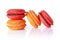 French dessert. Sweet red and orange macaroons or macarons