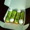 French dessert. Tasty lime eclairs with meringue in the box