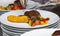 French dish breaded beef with vegetables and potatoes