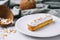 french eclair with coconut on plate