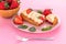 French eclair grazed with chocolate and fruity strawberry cream or sweet Italian profiteroles and fresh juicy strawberries