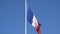 French flag with clear blue sky detail
