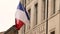 French flag on a facade of town hall