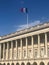 French flag waving on the top of Hotel de la Marine museum in Paris, France