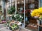 French florist store facade with flowers and open door