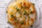 French food: Potato gratin on white plate closeup. horizontal to