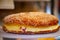 French fresh baked sweet filled brioche pastry tarte tropezienne in confectionery shop in Saint-Tropez, Provence, France