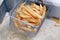 French fries, Basket French fries oil on the paper tissue sheet white, Tasty french fries in metal basket selective focus