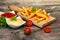 French fries with cherry tomato on table