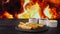 French fries disappear from a slate plate on fire flames background