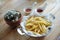 French fries in dish on the table, focusing