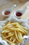 French fries in dish on the table, focusing