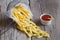 French fries in metal basket with tomato ketchup