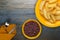 French fries on a plate on a wooden background.fast food top view.junk food