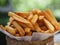 French fries, Potato chips Yellow crispy fries in wooden basket, food snack delicious