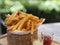 French fries, Potato chips Yellow crispy fries in wooden basket, snack delicious