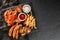 French fries potatoes, grilled meat and fish, chicken nuggets, spicy potato chips, ketchup and mayonnaise on black stone