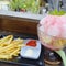 French fries with sauce and mayonnaise along with fruit ice