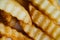 French fries slices background. Fast food french fries