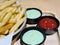 French Fries with Small Cups of Tomato and Wasabi Dipping Sauce