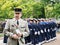 French general with Sailors marine group at parade in background