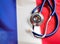 French Health. Medical stethoscope on a French flag. French health insurance concept