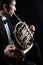 French horn player. Classical musicians playing brass music