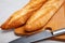 French loaves on wooden surface