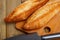 French loaves on wooden surface