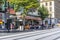 French locals and tourists enjoy an afternoon meal at a sidewalk cafe in Nice, France.