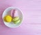 French macaroon on a pink wooden