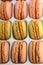 French macaroons, varied selection, colorful. Vertical photo