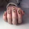 French manicure on women& x27;s thick handles with leopard design