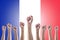 French May Labour day concept with human fists on France country flag pattern