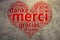 French: Merci, Heart shaped word cloud Thanks, Grunge Background