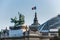 French National Flag  and statue on The Grand Palais in Paris, currently the largest existing ironwork and glass structure in the