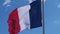 The French national flag waving in the wind.