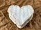 French Neufchatel cheese shaped heart on paper