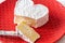 French Neufchatel cheese shaped heart in red plate