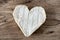 French Neufchatel cheese shaped heart on a wooden table