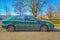 French old green sedan Citroen C5 right side view parked