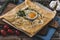 French pancake with fried egg, herbes and cheese on a wooden slat