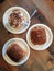 French pastry: Two pain au chocolat and one banana cream tarte on plates