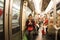 French people and foreigner travelers sitting inside of subway for journey around Paris city