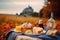 French picnic in autumn with mont saint-michel on background. Generative AI