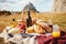 French picnic in autumn with mont saint-michel on background. Generative AI
