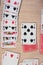 French playing cards stacked together in a solitaire. Solitaire game with cards, pastime with signs and cards with red backs and